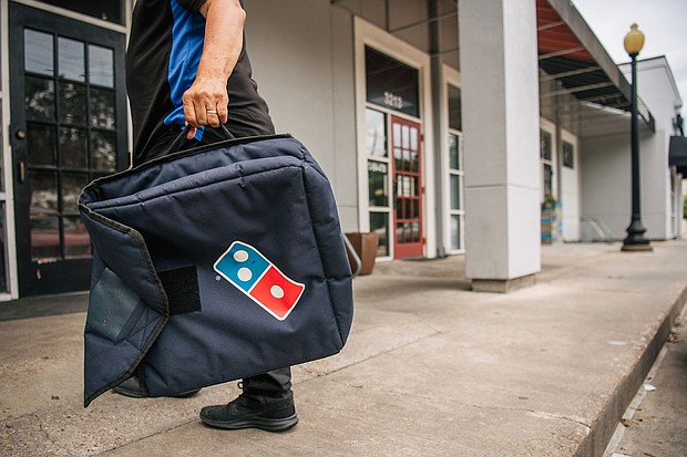 A Domino's Pizza employee returns from a delivery in 2021 in Houston, Texas.
Mandatory Credit:	Brandon Bell/Getty Images