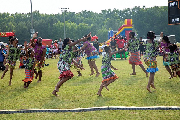 Akoma De Gado dancers and Sparkle Cheer and Danz (below) perform during Henrico County’s Juneteenth celebration at Dorey Park.