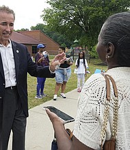 Virginia State Sen. Joe Morrissey greeted a voter at a polling precinct Tuesday in Henrico County.
