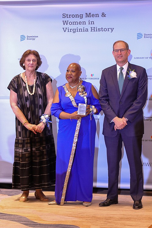 Robert Blue, chairman, president and CEO of Dominion, right, stands with Sandra Treadway, left, librarian of Virginia, and Danita Gail Wilkinson, middle, COO of the R.R. Wilkinson Foundation that is named after her father, the late Rev. Raymond Rogers Wilkinson, the Baptist minister and civil rights leader. Rev. Wilkinson and several other Virginians were honored during Dominion’s and the Library of Virginia’s “Strong Men & Women in Virginia History” awards program June 15 at the Hilton Richmond Hotel and Spa.