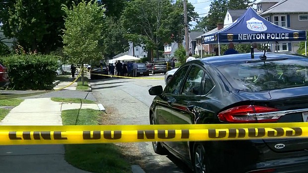 Police are seen at the location of an apparent triple homicide in Newton, Massachusetts, on Sunday.
Mandatory Credit:	WCVB