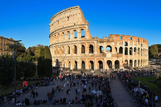 People gathered at the Colosseum in Rome on April 7, prior to the Way of the Cross (Via Crucis) prayer service as part of Holy Week celebrations.
Mandatory Credit:	Andreas Solaro/AFP/Getty Images