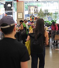 People shop at Lincoln Market on June 12, in the Prospect Lefferts Gardens neighborhood in the Brooklyn borough of New York City.
Mandatory Credit:	Michael M. Santiago/Getty Images