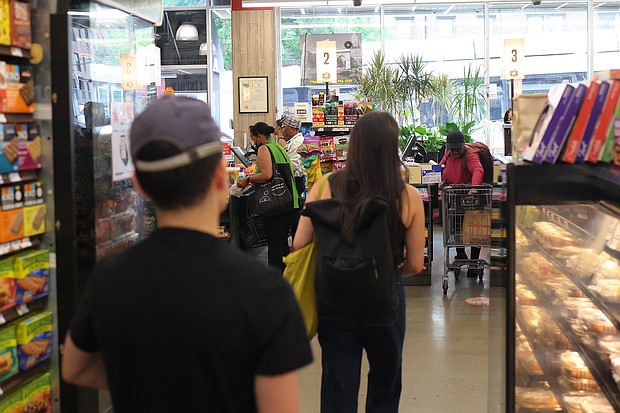 People shop at Lincoln Market on June 12, in the Prospect Lefferts Gardens neighborhood in the Brooklyn borough of New York City.
Mandatory Credit:	Michael M. Santiago/Getty Images