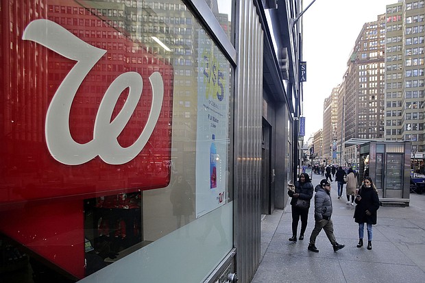 People make their way near a Walgreens pharmacy on March 09, in New York City.
Mandatory Credit:	Leonardo Munoz/VIEWpress/Corbis/Getty Images