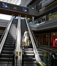 Americans are feeling far more confident about the economy. Pictured is a shopper at Brickell City Centre in Miami, on June 14.
Mandatory Credit:	Eva Marie Uzcategui/Bloomberg/Getty Images