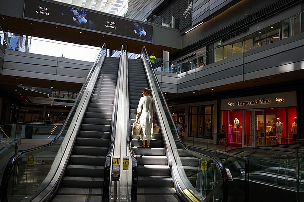 Americans are feeling far more confident about the economy. Pictured is a shopper at Brickell City Centre in Miami, on June 14.
Mandatory Credit:	Eva Marie Uzcategui/Bloomberg/Getty Images