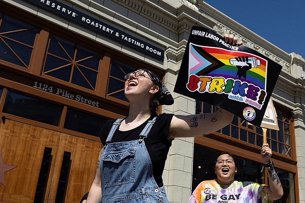 Starbucks workers attend a rally as part of a collective action over a Pride decor dispute, outside the Starbucks Reserve Roastery in Seattle, Washington, June 23.
Mandatory Credit:	Matt Mills McKnight/Reuters