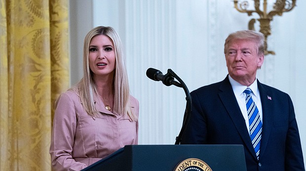 Former President Donald Trump (right) watches his daughter Ivanka Trump, address an event in the East Room of the White House on April 28, 2020.
Mandatory Credit:	Doug Mills/The New York Times/Redux