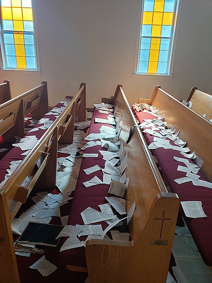 Pages that were torn from Bibles and hymnals litter the pews and sanctuary at Fowler United Methodist Church in Annapolis, Md, on June 9, 2023.
