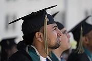 Incarcerated graduate Gerald Massey listens to a speech during his graduation ceremony at Folsom State Prison in Folsom, Calif., Thursday, May 25.