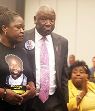 Caroline Ouko, left, the mother of Irvo Otieno, is accompanied by civil rights attorney Benjamin L. Crump as they arrive at the “Justice for Irvo Otieno Townhall,” on May 24 at Virginia Union University. On Wednesday, Mr. Crump and his co-counsel Mark J. Krudys in the Irvo Otieno case are requesting that the United States Department of Justice open a criminal investigation into the circumstances of Mr. Otieno’s death.