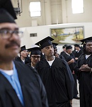 Incarcerated graduates, who finished various educational and vocational programs in prison, wait for the start of their graduation ceremony at Folsom State Prison in Folsom, Calif., Thursday, May 25. Thousands of prisoners throughout the United States get their college degrees behind bars, most of them paid for by the federal Pell Grant program, which offers the neediest undergraduates tuition aid that they don’t have to repay.
That program is about to expand exponentially next month, giving about 30,000 more students behind bars some $130 million in financial aid per year.