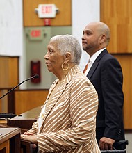 The couple’s son, Raymond H. Boone Jr., stands next to his mother, Mrs. Boone.