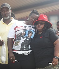 During a June 11 vigil at Abner Clay Park, Rennada Smith Bass, center, of Monroe La. is consoled as she and her family grieve the loss of their brother, Renzo Dell Smith, who was killed Tuesday, June 6 along with his stepson Shawn Jackson, 18. Before being shot, Mr. Jackson had just walked across the stage and received his diploma during his Huguenot High School graduation at Altria Theater. Richmond police note that none of the guns confiscated in the aftermath were brought into the Altria Theater. Police also said that the shooting sprang from a confrontation between Mr. Jackson and the shooter, Amari Pollard.