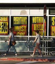 Shoppers enter exit a Bed Bath & Beyond store on May 29 in Glendale, Colorado,
Mandatory Credit:	David Zalubowski/AP