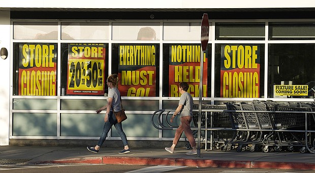Shoppers enter exit a Bed Bath & Beyond store on May 29 in Glendale, Colorado,
Mandatory Credit:	David Zalubowski/AP