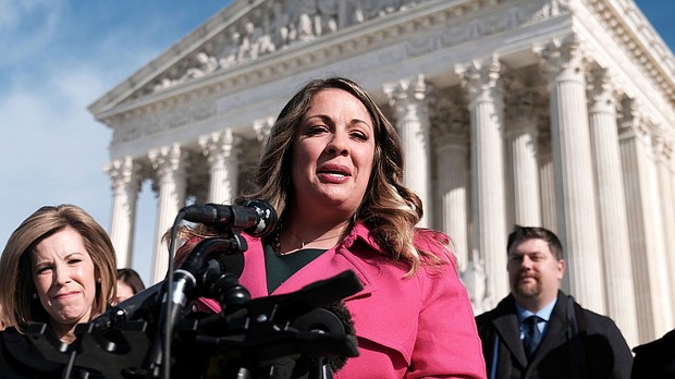 Lorie Smith, a web designer from Colorado, speaks to reporters outside after the Supreme Court heard arguments in her First Amendment battle pitting claims of religious freedom against laws prohibiting discrimination on the basis of sexual orientation in Washington, DC, on December 5, 2022.
Mandatory Credit:	Michael A. McCoy/The New York Times/Redux