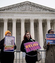 People rally in support of the Biden administration's student debt relief plan in front of the the U.S. Supreme Court on February 28 in Washington, DC.
Mandatory Credit:	Drew Angerer/Getty Images