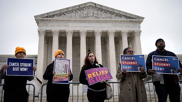 People rally in support of the Biden administration's student debt relief plan in front of the the U.S. Supreme Court on February 28 in Washington, DC.
Mandatory Credit:	Drew Angerer/Getty Images
