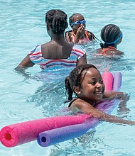 Heaven Saunders, 6, floats in Battery Park’s swimming pool with her cousins, from left, Johmyra Harris, 11, twin sisters Ja’lia Pringle-Saunders and Tai’lia Pringle-Saunders, both 10, and Jerrya Harris, 13. The girls were visiting the pool with their grandmother, Janice Pringle.