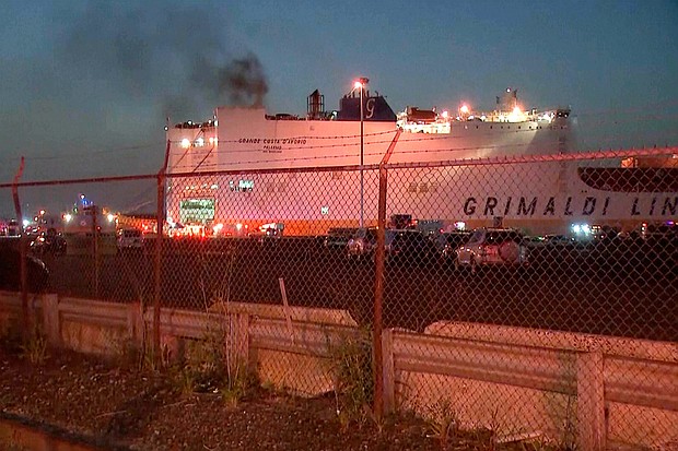 Smoke rises early Thursday from a cargo ship in the port of Newark, New Jersey.
Mandatory Credit:	WABC-TV/AP