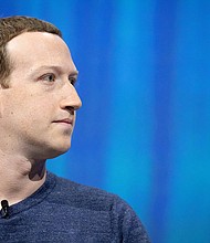 Mark Zuckerberg attends a tech event in Paris, France in 2018. When Zuckerberg shared a photo on Instagram of his family on July 4, two things stuck out: the billionaire CEO wore a striped souvenir cowboy hat, and the faces of his children were replaced with happy face emojis.
Mandatory Credit:	Christophe Morin/IP3/Getty Images