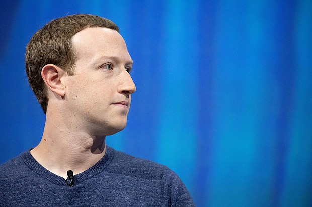 Mark Zuckerberg attends a tech event in Paris, France in 2018. When Zuckerberg shared a photo on Instagram of his family on July 4, two things stuck out: the billionaire CEO wore a striped souvenir cowboy hat, and the faces of his children were replaced with happy face emojis.
Mandatory Credit:	Christophe Morin/IP3/Getty Images