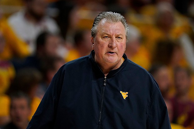 Bob Huggins watches from the bench during the first half of an NCAA college basketball game against Iowa State on February 27, in Ames, Iowa. Huggins now claims he did not resign from the school after he was arrested and charged with driving under the influence in Pittsburgh last month, his attorney said.
Mandatory Credit:	Charlie Neibergall/AP