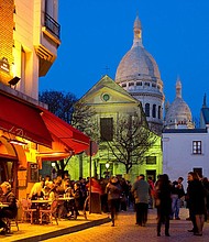 Who couldn't resist a glass of wine in the Montmartre area of Paris? Just make sure you're legal age first.
Mandatory Credit:	Sylvain Sonnet/The Image Bank RF/Getty Images