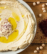 Serve up hummus in a spread made from chickpeas and seasoned with sumac and oil. Sumac can bring out the natural flavors of food much like salt does.
Mandatory Credit:	Ionut Groza/500px/Getty Images