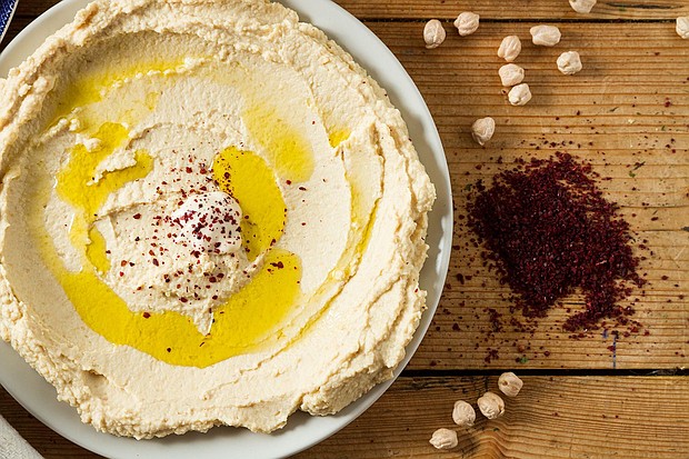 Serve up hummus in a spread made from chickpeas and seasoned with sumac and oil. Sumac can bring out the natural flavors of food much like salt does.
Mandatory Credit:	Ionut Groza/500px/Getty Images