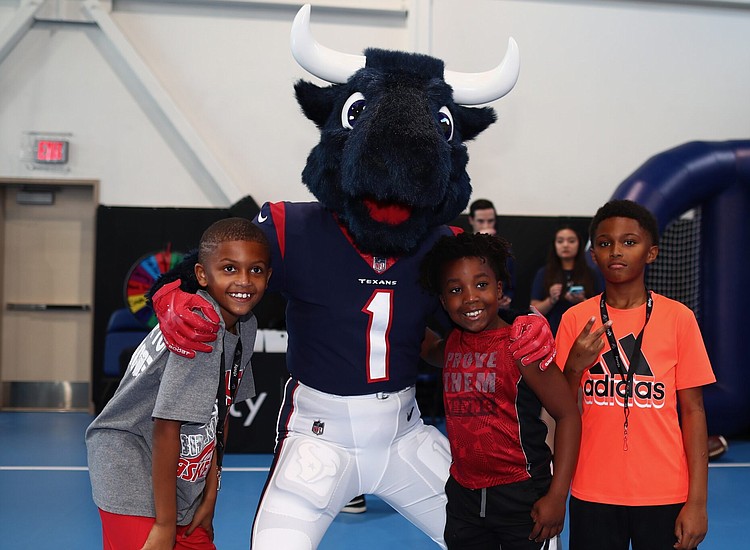 Houston Texans and Crime Stoppers Join Tech Leader to Surprise Youth, Houston Style Magazine