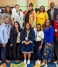 Superintendent James Colbert Jr., left, and Trustee Danny Norris, top right, pose for a photograph with members of the Harris County Department of Education staff that attended and presented at the HAABSE summer conference.