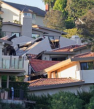 A view shows damaged houses, which were evacuated due to a growing fissure causing a landslide, in the Rolling Hills Estates, California.
Mandatory Credit:	David Swanson/Reuters