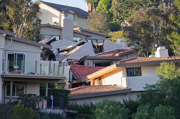 A view shows damaged houses, which were evacuated due to a growing fissure causing a landslide, in the Rolling Hills Estates, California.
Mandatory Credit:	David Swanson/Reuters