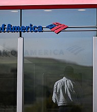 A customer uses an ATM outside of a Bank of America branch.
Mandatory Credit:	Patrick T. Fallon/AFP/Getty Images