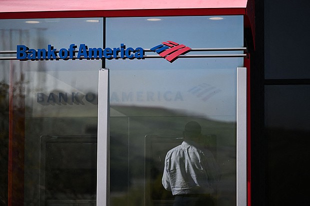 A customer uses an ATM outside of a Bank of America branch.
Mandatory Credit:	Patrick T. Fallon/AFP/Getty Images