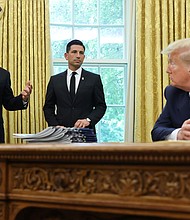 Then-US President Donald Trump listens to Vice President Mike Pence and acting Secretary of Homeland Security Chad Wolf, May 28, 2020.
Mandatory Credit:	Jonathan Ernst/Reuters