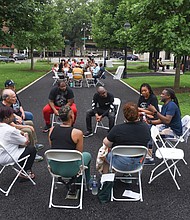 Initiatives of Change gathered for an “I AM HERE” community-wide healing circle last Friday at Monroe Park near the Altria Theater where two men, Shawn Jackson and Enzo Smith, were shot and killed at Monroe Park on June 6 after leaving Huguenot High School’s graduation ceremonies. Nearly a dozen others were injured. An alleged gunman, Amari Ty-Jon Pollard, 19, was arrested.