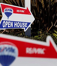 RE/MAX Holdings Inc. signage is displayed outside of an open house in Redondo Beach, California, in February 2015.  RE/MAX chairman Dave Liniger says homebuyers must "learn to live" with near-7% mortgage rates.
Mandatory Credit:	Patrick T. Fallon/Bloomberg/Getty Images/FILE