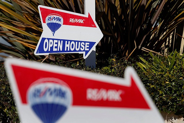 RE/MAX Holdings Inc. signage is displayed outside of an open house in Redondo Beach, California, in February 2015.  RE/MAX chairman Dave Liniger says homebuyers must "learn to live" with near-7% mortgage rates.
Mandatory Credit:	Patrick T. Fallon/Bloomberg/Getty Images/FILE