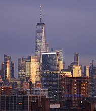 Remote work risks wiping $800 billion from the value of office buildings in major cities worldwide by 2030 as the post-pandemic trend pushes up office vacancy rates and drives down rents, according to a new report.
Mandatory Credit:	Gary Hershorn/Corbis News/Getty Images