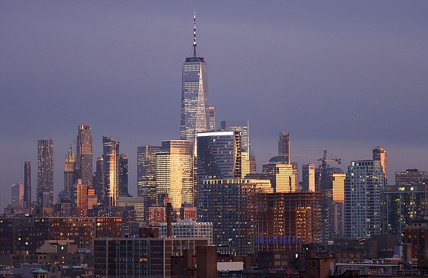 Remote work risks wiping $800 billion from the value of office buildings in major cities worldwide by 2030 as the post-pandemic trend pushes up office vacancy rates and drives down rents, according to a new report.
Mandatory Credit:	Gary Hershorn/Corbis News/Getty Images