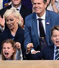 Charlotte and George cheer emphatically as they watch the epic men's finale of the prestigious tennis tournament.
Mandatory Credit:	Karwai Tang/WireImage/Getty Images