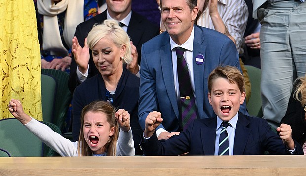 Charlotte and George cheer emphatically as they watch the epic men's finale of the prestigious tennis tournament.
Mandatory Credit:	Karwai Tang/WireImage/Getty Images