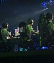Members of the Houston Outlaws team play Overwatch during the Activision Blizzard Inc. Overwatch League 'Battle For Texas' tournament at Tech Port Arena in San Antonio, Texas, on May 6, 2022.
Mandatory Credit:	Sergio Flores/Bloomberg/Getty Images