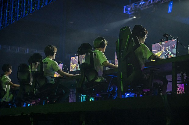 Members of the Houston Outlaws team play Overwatch during the Activision Blizzard Inc. Overwatch League 'Battle For Texas' tournament at Tech Port Arena in San Antonio, Texas, on May 6, 2022.
Mandatory Credit:	Sergio Flores/Bloomberg/Getty Images