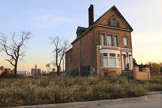 Massive population loss that began in the 1950s and a decades long downturn in the auto industry and other manufacturers severely slashed Detroit’s tax base. Many neighborhoods were rife with vacant and burned out houses. Empty lots became dumping grounds for trash, used tires and even boats.