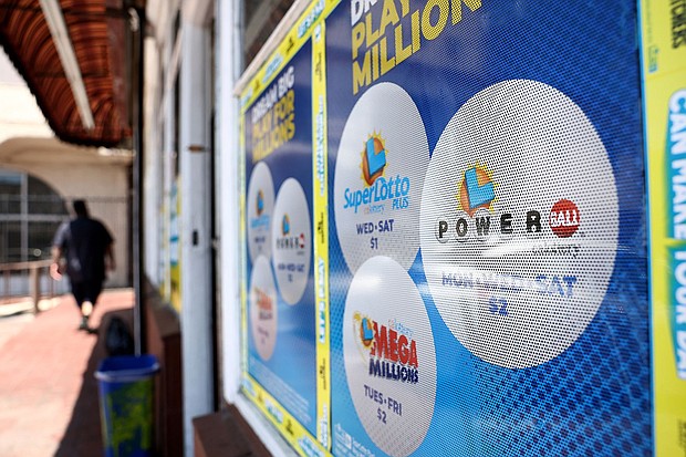 A California Lottery poster advertises Powerball and other lotteries at a convenience store on July 18, in Los Angeles.
Mandatory Credit:	Mario Tama/Getty Images